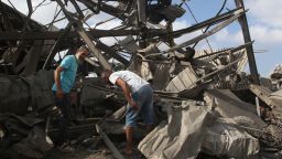 Men inspect the damage to a building after an Israeli strike in Nabatiyeh, Lebanon, on August 17.