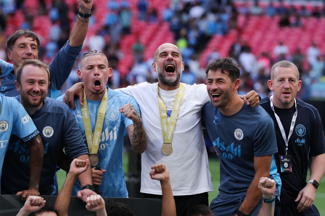 LONDON, ENGLAND – AUGUST 10: Josep “Pep” Guardiola, manager of Manchester City, celebrates with Kalvin Phillips after the 2024 FA Community Shield match between Manchester United and Manchester City at Wembley Stadium on August 10, 2024 in London, England. (Photo by James Gill – Danehouse/Getty Images)