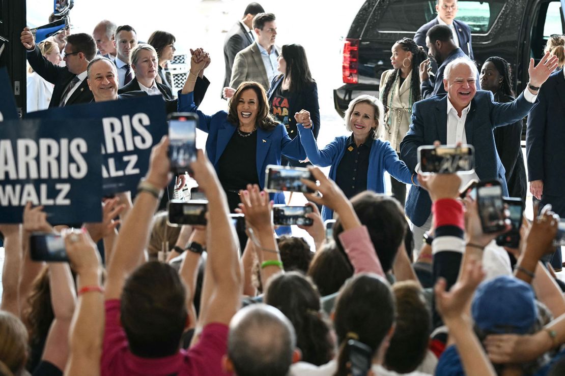 From left to right, second gentleman Doug Emhoff, Vice President Kamala Harris, Minnesota first lady Gwen Walz and Minnesota Gov. Tim Walz wave to supporters at Pittsburgh International Airport on August 18, 2024.