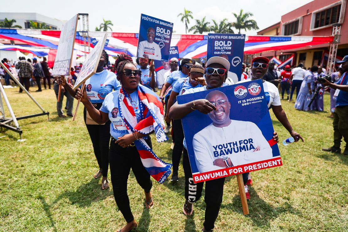 Supporters hold a placard depicting the portrait of Mahamudu Bawumia, in Takoradi, on August 18, 2024.