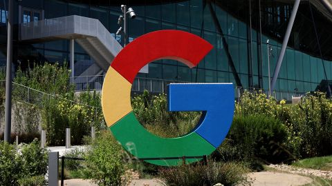 The Google logo is displayed in front of company headquarters.