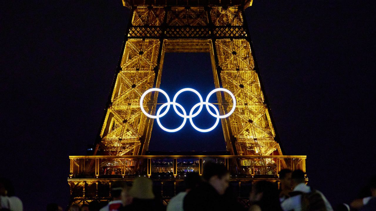 The Olympic rings are displayed on the Eiffel Tower at night between the Paris 2024 Olympic and Paralympic Games, in Paris on August 19, 2024. (Photo by Adnan Farzat/NurPhoto via Getty Images)