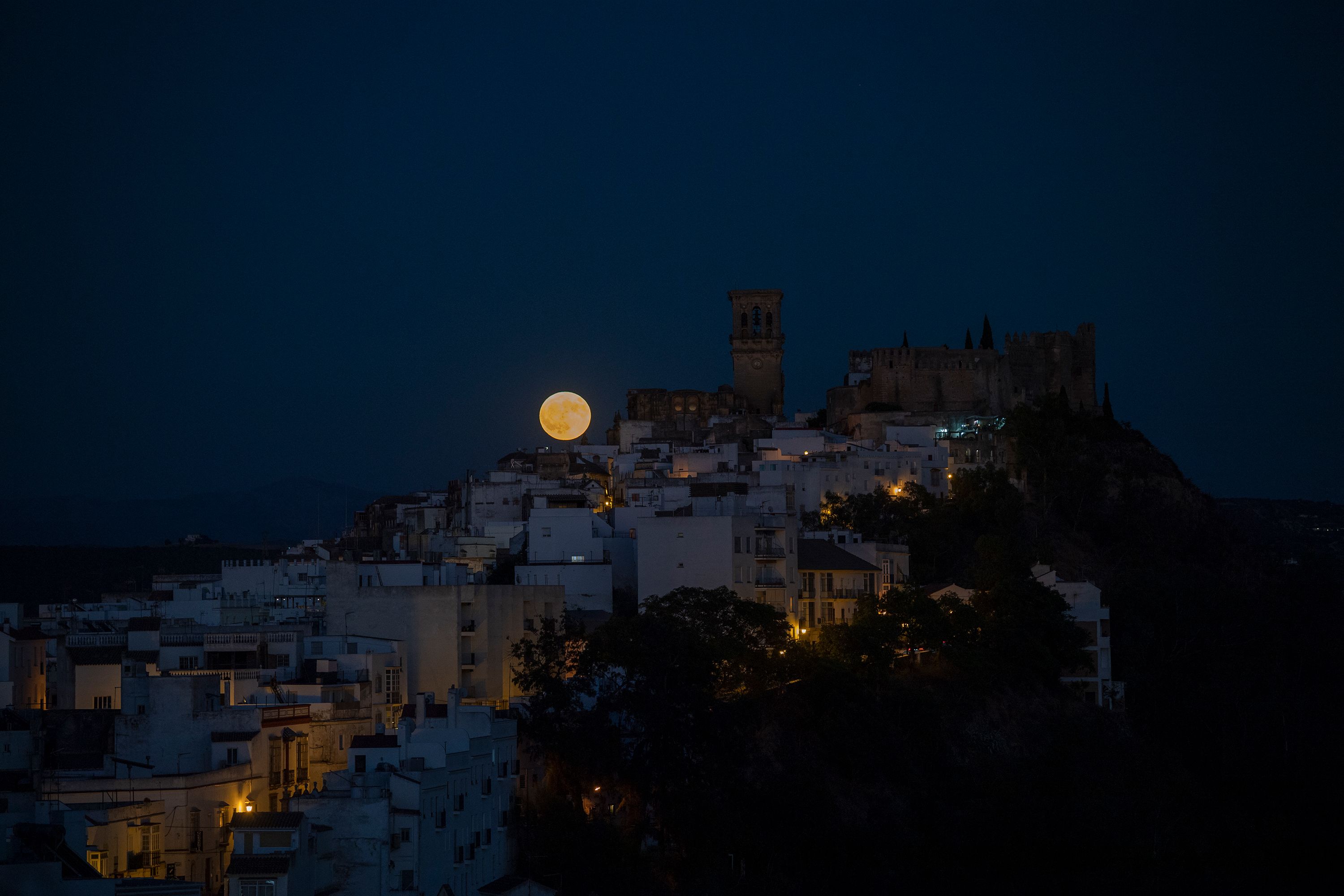 The super moon rises in Arcos de la Frontera, Spain.