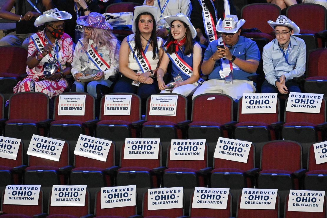 Delegates and attendees wear cowboy hats and "Cowboy Kamala" banners on the first day of the Democratic National Convention (DNC) at the United Center in Chicago, Illinois, on August 19.