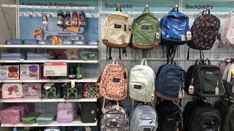 At Target in New York City, a variety of school supplies, including lunch boxes and backpacks in different colors and patterns, are on display for the upcoming school year.