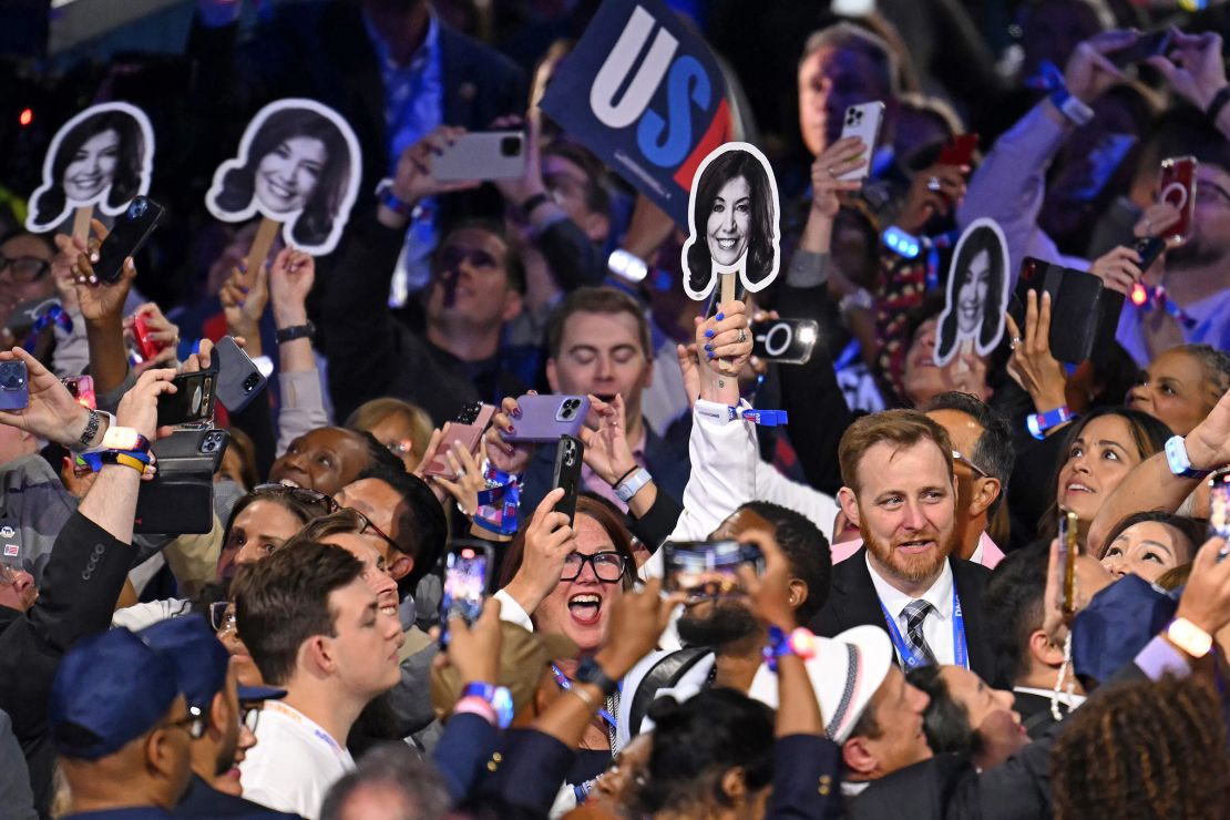 Members of the New York delegation hold pictures of Hochul during the ceremonial roll call vote at the Democratic National Convention in Chicago on August 20, 2024.