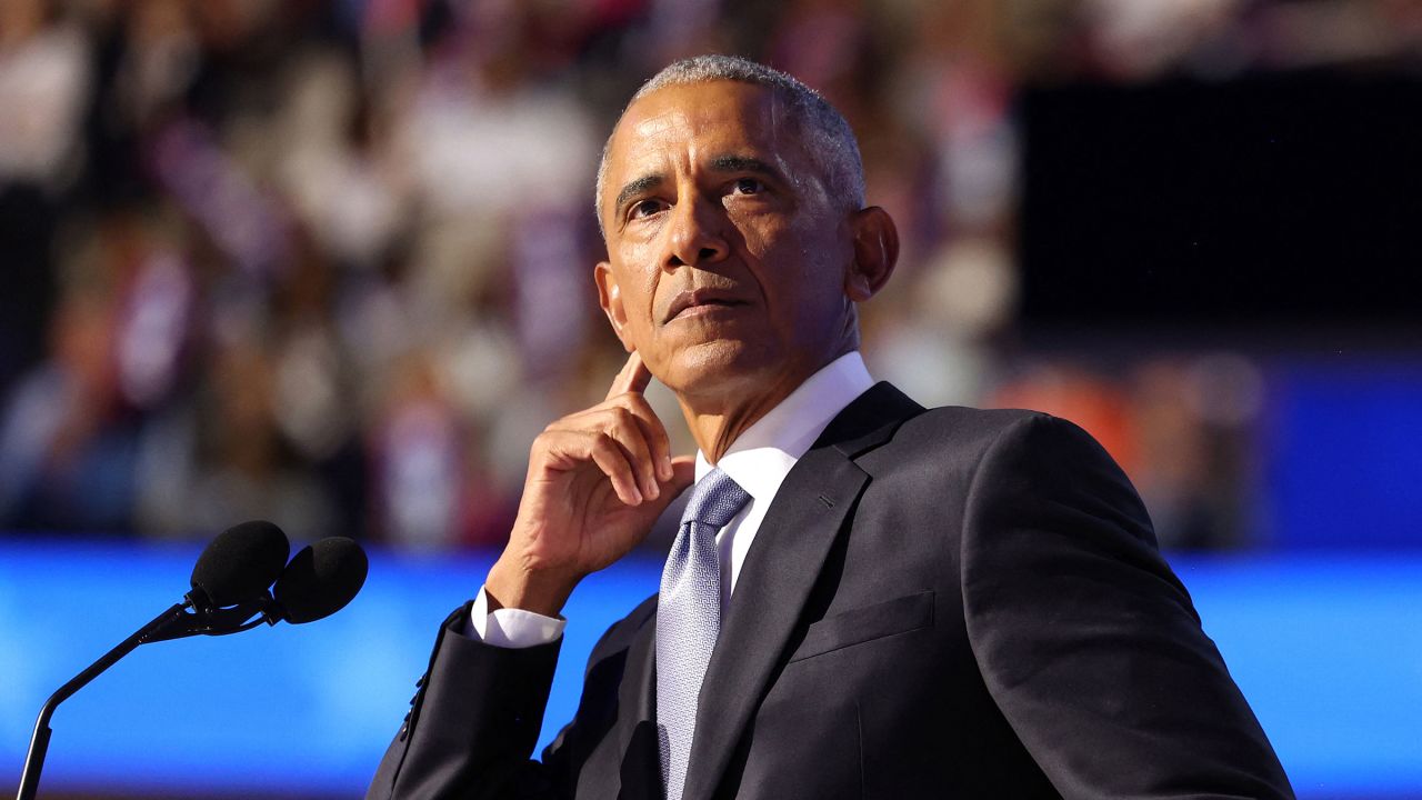 Former President Barack Obama gestures as he speaks at the Democratic National Convention in Chicago on August 20, 2024.