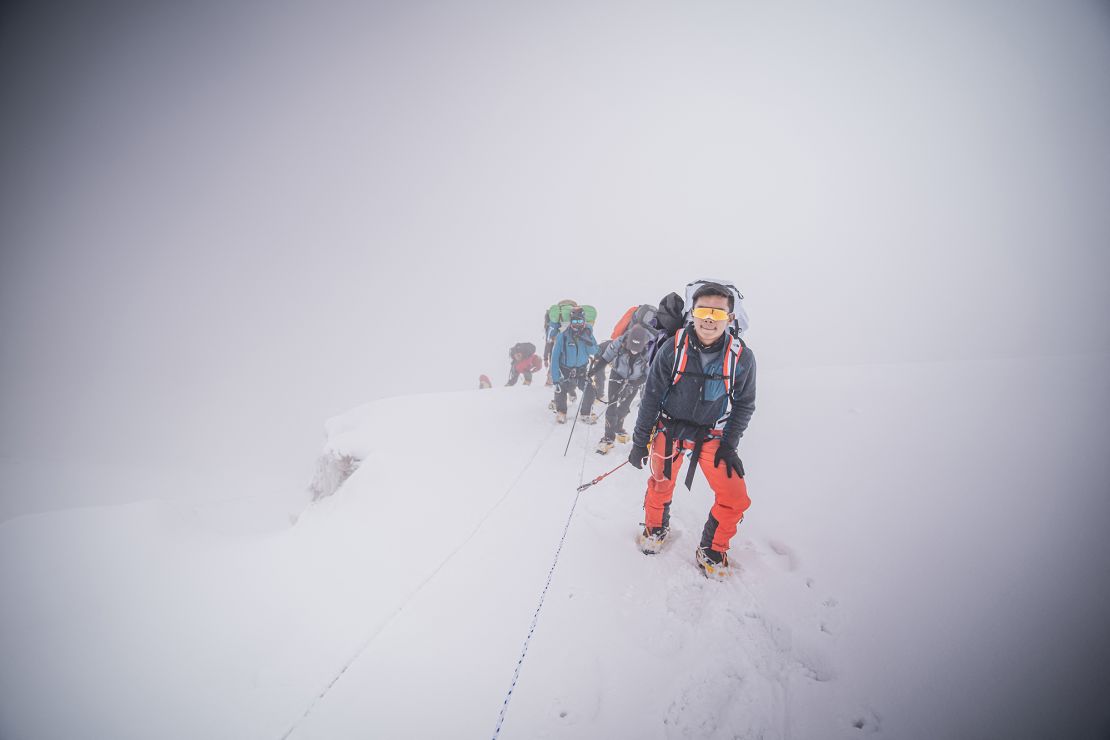 Nepalese mountaineer Nima Rinji Sherpa ascends to the summit of Mount Everest in this photograph taken on May 23, 2024 and published by 14 Peaks Expedition.