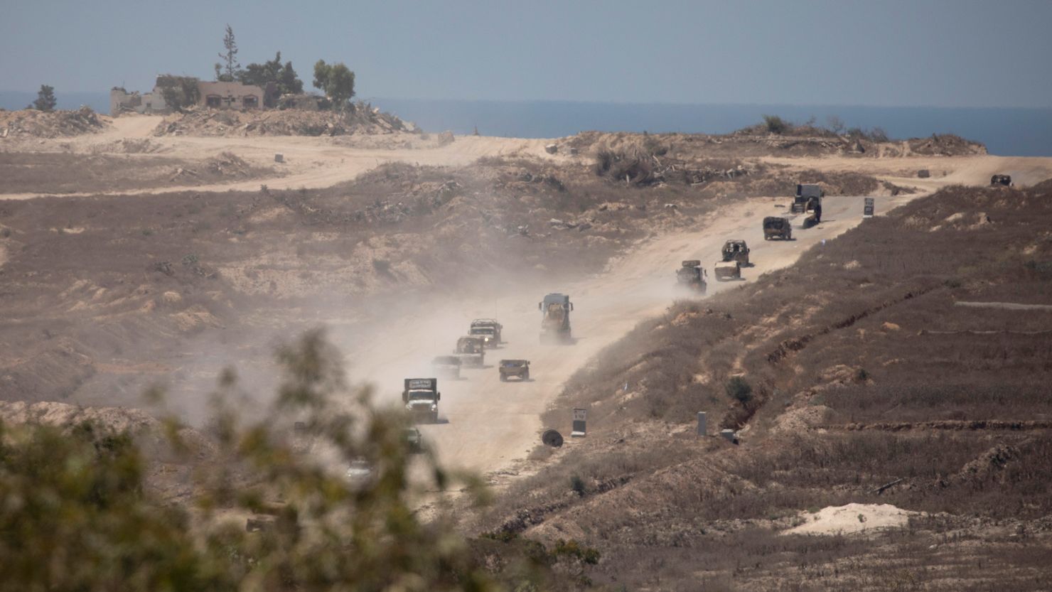 An Israeli army convoy moves along the border with the Gaza Strip in southern Israel on August 21, 2024.