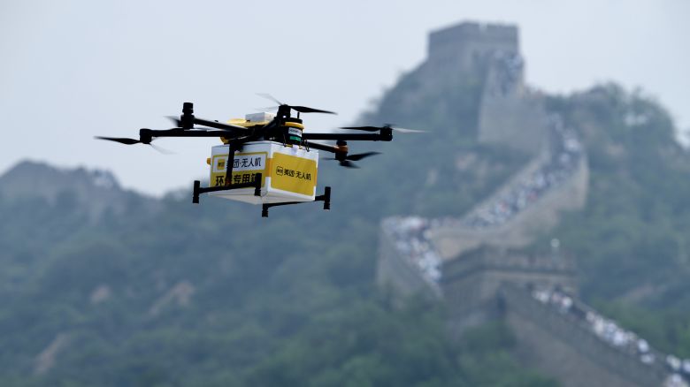 An unmanned aerial vehicle (UAV) delivers Meituan packages in the Badaling section of the Great Wall on August 16, 2024 in Beijing, China.