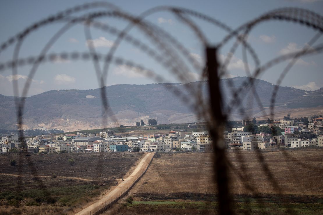 The Blue line dividing Israel (at left) and Lebanon (at right) can be seen while looking toward the Lebanese border town of Aadaysit from the a UNIFIL base in Kafarkila, Lebanon on August 16.