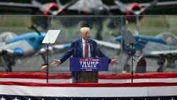 Former US President and Republican presidential candidate Donald Trump speaks behind bulletproof glass during a campaign rally at the North Carolina Aviation Museum & Hall of Fame in Asheboro, North Carolina, August 21, 2024. (Photo by Peter Zay / AFP) (Photo by PETER ZAY/AFP via Getty Images)