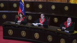 Venezuelan Supreme Court of Justice (TSJ) President Caryslia Rodriguez (C) delivers a statement by the Supreme Court of Venezuela on the results of the country's presidential election at the TSJ building in Caracas on August 22, 2024. Venezuela's Supreme Court, which observers say is loyal to the government of President Nicolas Maduro, on Thursday declared him the winner of the disputed July 28 election amid opposition claims of widespread vote fraud. (Photo by Federico PARRA / AFP) (Photo by FEDERICO PARRA/AFP via Getty Images)