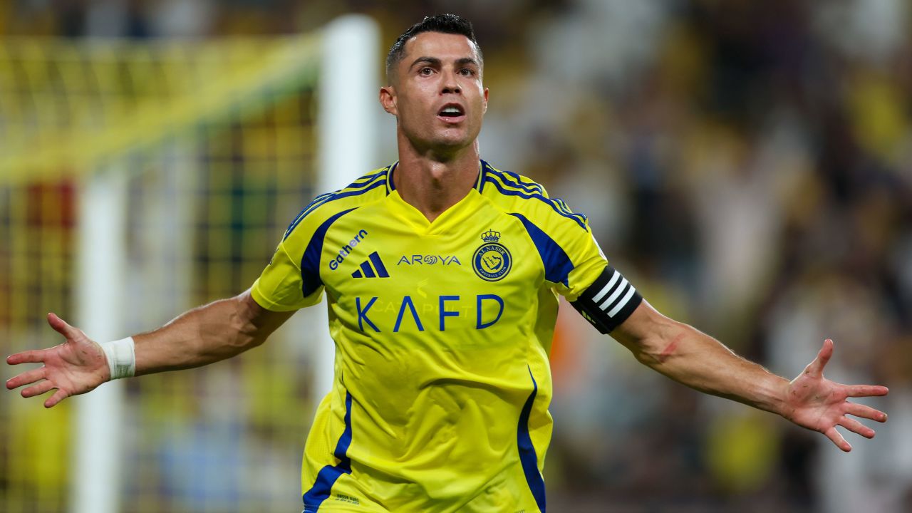 RIYADH, SAUDI ARABIA - AUGUST 22: Cristiano Ronaldo of Al Nassr celebrating after scores the 1st goal during the Saudi Pro League match between Al Nassr and Al Raed at Al Awwal Park Stadium on August 22, 2024 in Riyadh, Saudi Arabia. (Photo by Yasser Bakhsh/Getty Images)