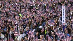 CHICAGO, ILLINOIS - AUGUST 22: Delegates wave American flags on day 4 of the Democratic National Convention at the United Center on August 22, 2024 in Chicago, Ill. (Photo by Ricky Carioti/The Washington Post via Getty Images)