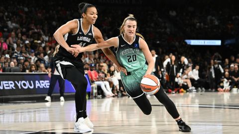 Sabrina Ionescu #20 of the New York Liberty dribbles the ball past Kiah Stokes #41 of the Las Vegas Aces in the first half of their game at Michelob ULTRA Arena on August 17, 2024 in Las Vegas, Nevada.