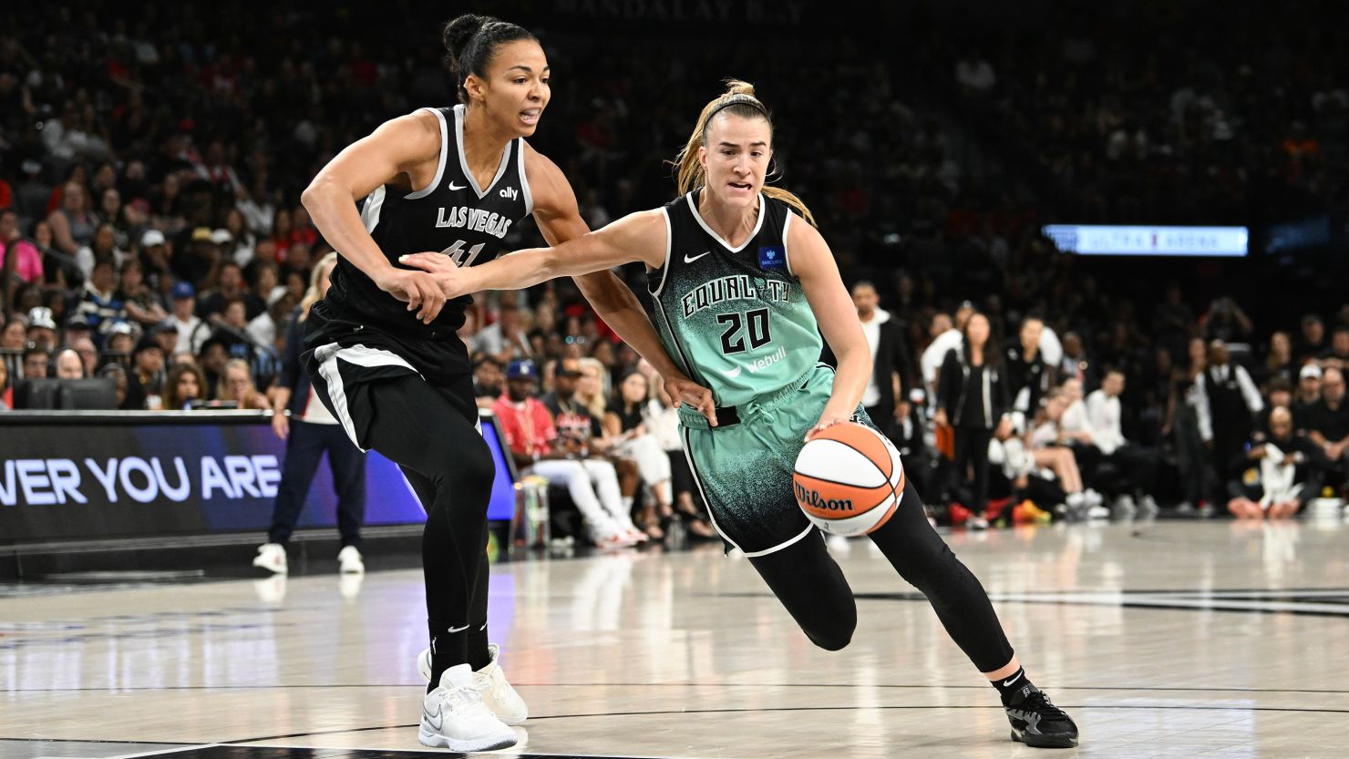 Sabrina Ionescu's 23 points led New York Liberty to victory against Las Vegas Aces and a playoff berth.