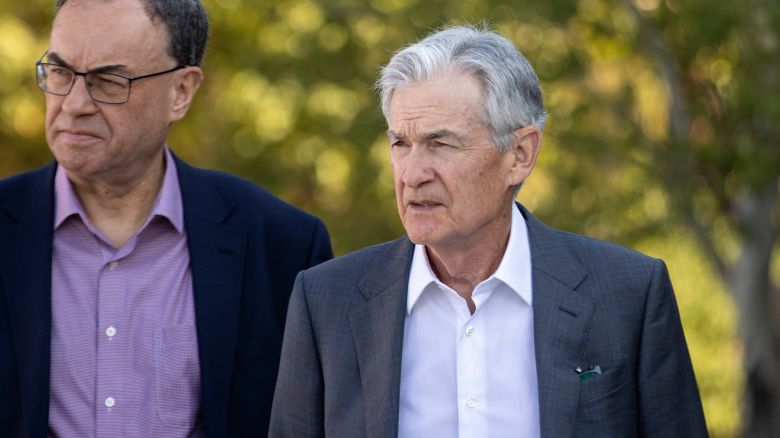 Jerome Powell, chairman of the US Federal Reserve, right, during the Kansas City Federal Reserve's Jackson Hole Economic Policy Symposium in Moran, Wyoming, US, on Friday, Aug. 23, 2024. Powell said the time has come for the Federal Reserve to cut its key policy rate, affirming expectations that officials will begin lowering borrowing costs next month and making clear his intention to prevent further cooling in the labor market.