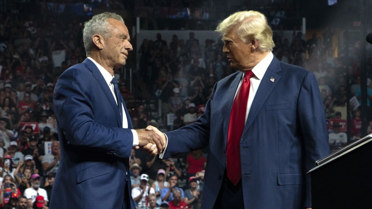 GLENDALE, ARIZONA - AUGUST 23: Former Republican presidential candidate Robert F. Kennedy Jr. and Republican presidential nominee, former U.S. President Donald Trump shake hands during a campaign rally at Desert Diamond Arena on August 23, 2024 in Glendale, Arizona. Kennedy announced today that he was suspending his presidential campaign and supporting former President Trump. (Photo by Rebecca Noble/Getty Images)