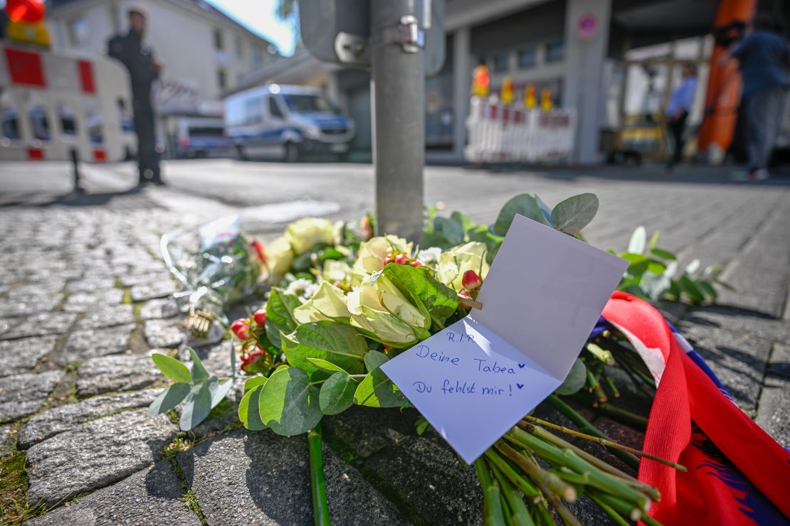 Flowers are left at the site of Friday's deadly stabbings in Solingen, Germany.