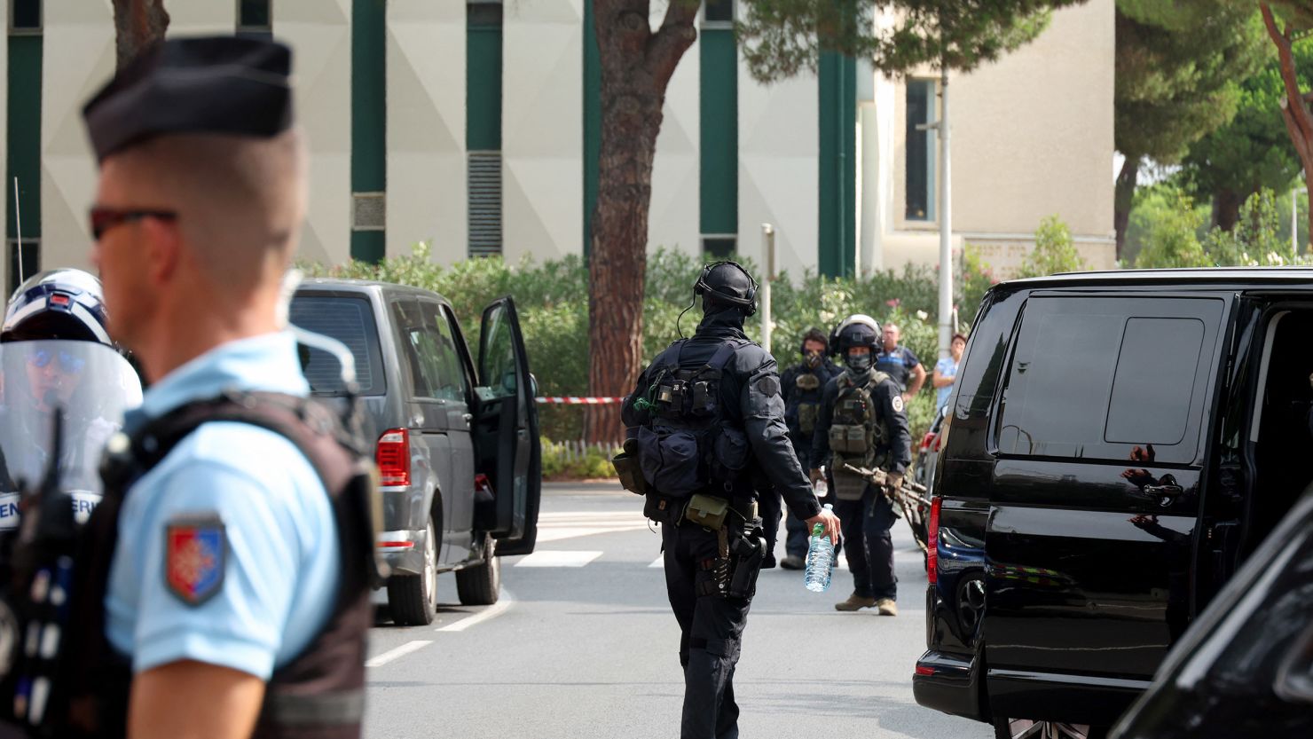 Law enforcement officers stand nearby a synagogue in La Grande-Motte, France, following a purported arson attack on Saturday.