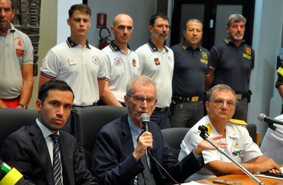 Prosecutor Raffaele Cammarano (L), chief of the public prosecutor's office of Termini Imerese Ambrogio Cartosio (C) and Rear admiral of the Italian Coast Guards Raffaele Macauda (R) give a press conference on August 24, 2024 in Termini Imerese, Sicily. Sicilian prosecutors said they were investigating potential crimes of negligent shipwreck and manslaughter after a superyacht sank killing seven people, including UK tech tycoon Mike Lynch. Prosecutors stressed the investigation was at an early stage following the sinking of the British-flagged sailing boat Bayesian off the north of the Italian island in a storm early on August 19, 2024. (Photo by Alessandro FUCARINI / AFP) (Photo by ALESSANDRO FUCARINI/AFP via Getty Images)