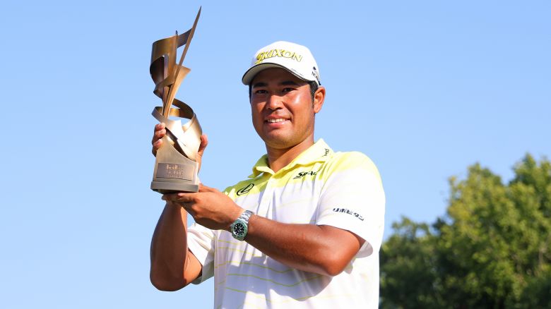 Hideki Matsuyama of Japan poses with the trophy after winning the FedEx St. Jude Championship at TPC Southwind on August 18, 2024 in Memphis, Tennessee.