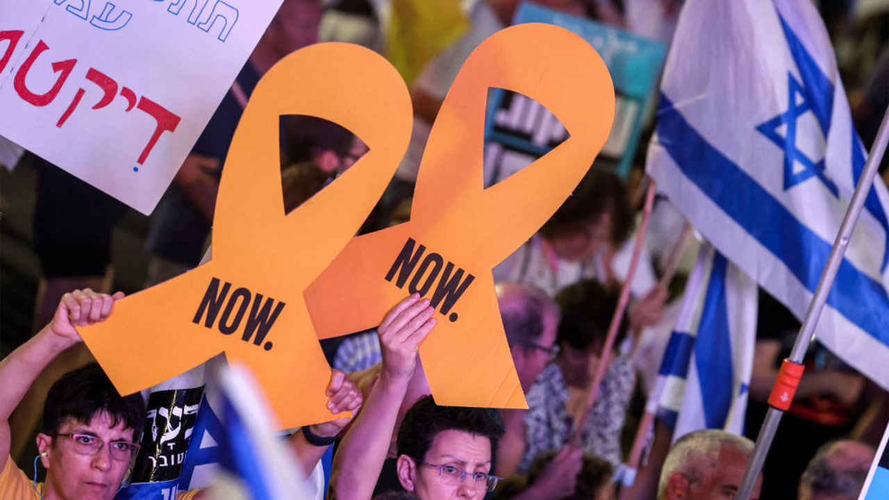 Protesters attend a demonstration demanding action to free the Israeli hostages captive in the Gaza Strip since the October 7 attacks outside the Israeli Defence Ministry headquarters in Tel Aviv on August 24, 2024 amid the ongoing conflict in the Palestinian territory between Israel and Hamas. (Photo by Jack GUEZ / AFP) (Photo by JACK GUEZ/AFP via Getty Images)