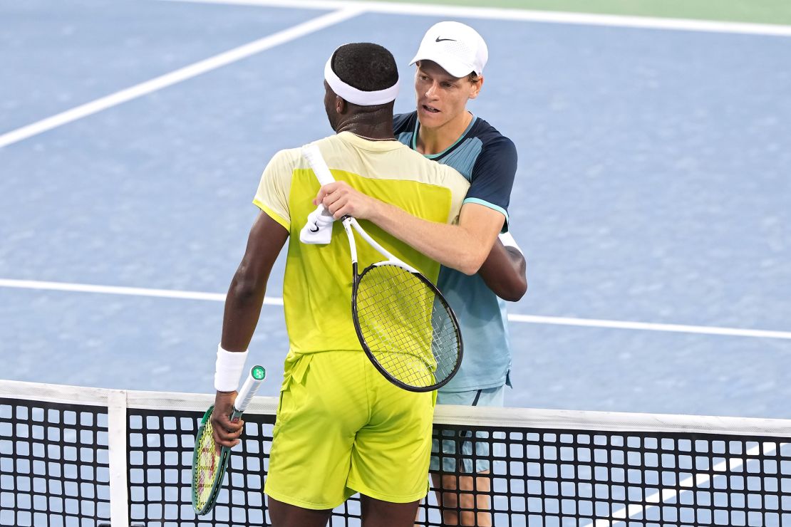 Jannik Sinner hugs Frances Tiafoe after Sinner defeated him 7-6(4), 6-2 to win the men's 2024 Cincinnati Open title.