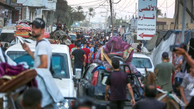 Palestinians evacuate patients from Al Aqsa Martyrs Hospital after the Israeli army demanded Palestinians evacuate an area east of Deir al-Balah