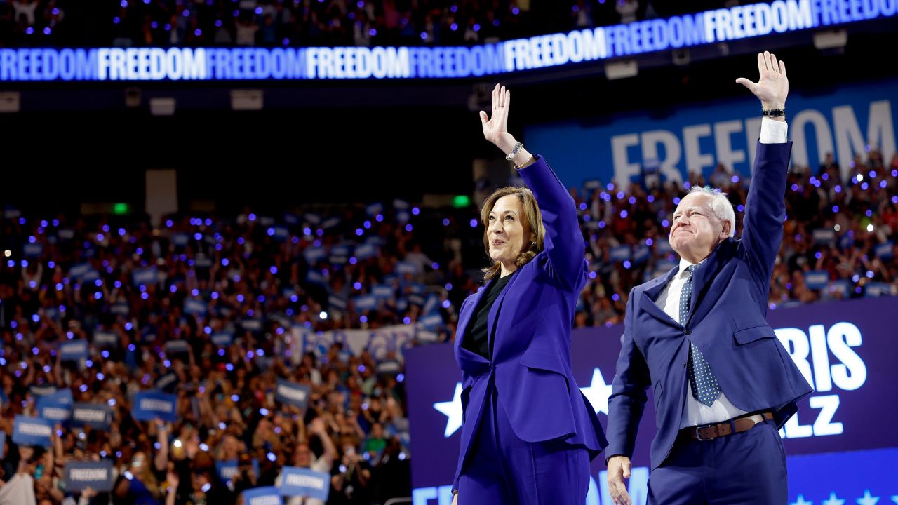 Democratic presidential candidate, Vice President Kamala Harris and democratic vice presidential candidate Minnesota Gov. Tim Walz walk onstage for a campaign rally at the Fiserv Forum in Milwaukee, Wisconsin on August 20, 2024. Later this week Harris will accept her party's presidential nomination at the Democratic National Convention in Chicago, Illinois.