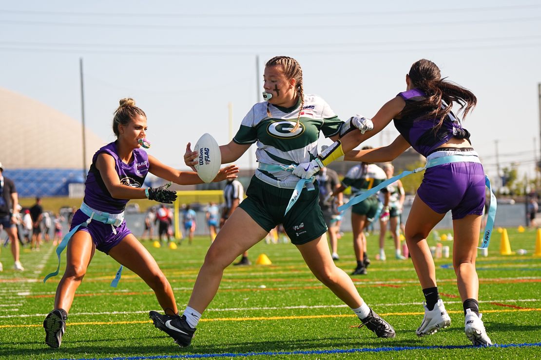 Flag Football: A young girl in action runs with the football during the 2024 Flag Football Championships at the Hall of Fame Village. Canton, OH 07/20/2024 CREDIT: Erick W. Rasco (Photo by Erick W. Rasco/Sports Illustrated via Getty Images) (game number: X164542)