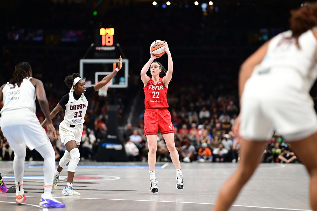 Clark shoots from three-point range during the game.