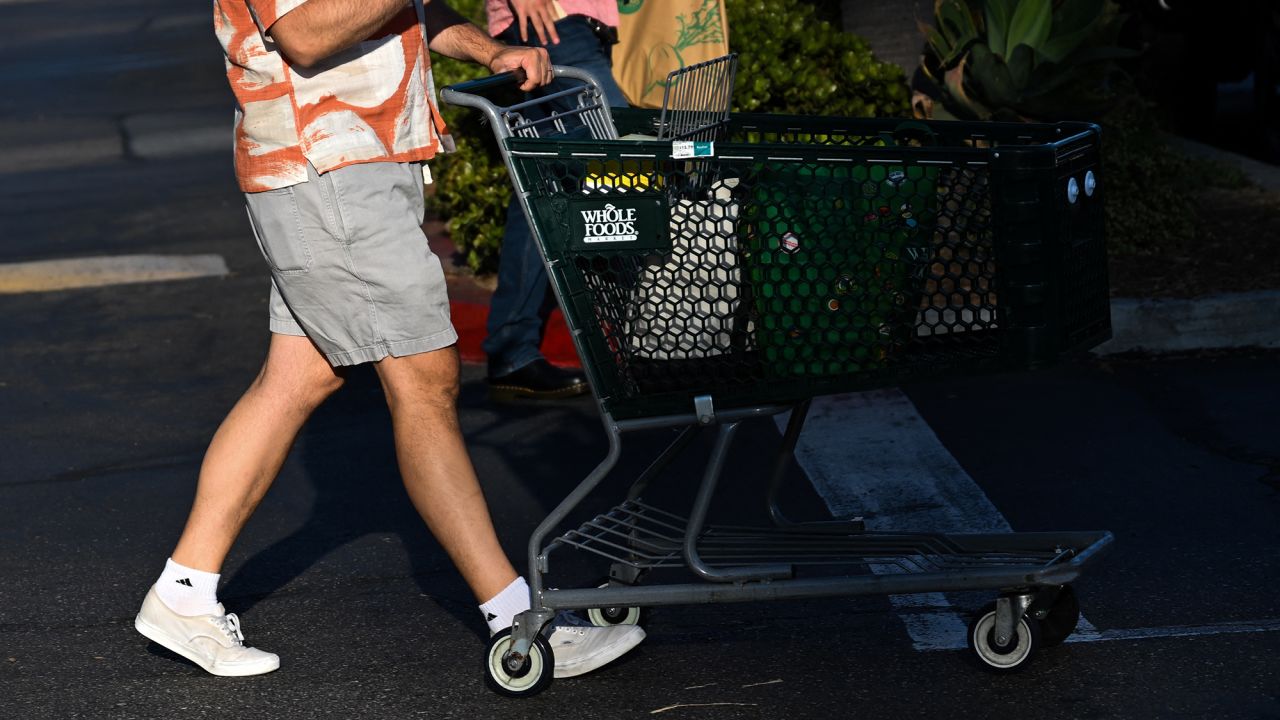 Whole Foods says it is working to restock shelves following a cyberattack that has disrupted operations at United Natural Foods, a major supplier.
