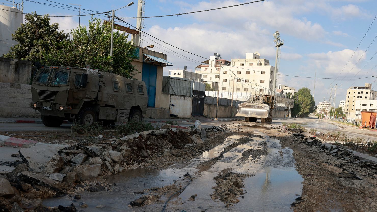 Israeli military vehicles drive down a road during a raid in the northern city of Tulkarem in the occupied West Bank on Wednesday.