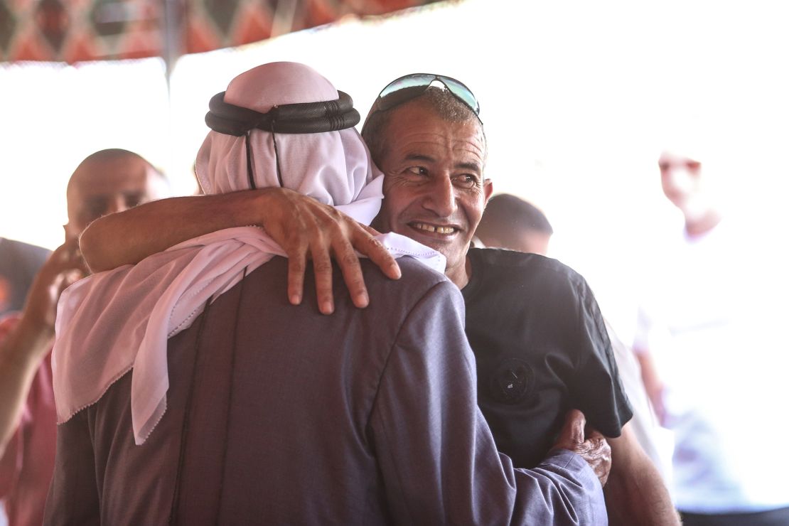 Farhan Al-Qadi, a Bedouin Israeli hostage who was kidnapped on October 7 by Hamas, is greeted by his friends and family after he is rescued, at his village near Rahat in southern Israel, on August 28.