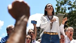 Venezuelan opposition leader Maria Corina Machado signs their national anthem during a rally in Caracas on August 28, 2024. Venezuela's opposition supporters rallied on August 28, a month after the disputed re-election of President Nicolas Maduro, who armoured his cabinet with a strongman at the helm of law and order. (Photo by JUAN BARRETO / AFP) (Photo by JUAN BARRETO/AFP via Getty Images)