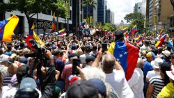 Venezuelan opposition leader Maria Corina Machado (C top) speaks to supporters during a rally in Caracas on August 28, 2024. Venezuela's opposition supporters rallied on August 28, a month after the disputed re-election of President Nicolas Maduro, who armoured his cabinet with a strongman at the helm of law and order. (Photo by Pedro Rances Mattey / AFP) (Photo by PEDRO RANCES MATTEY/AFP via Getty Images)