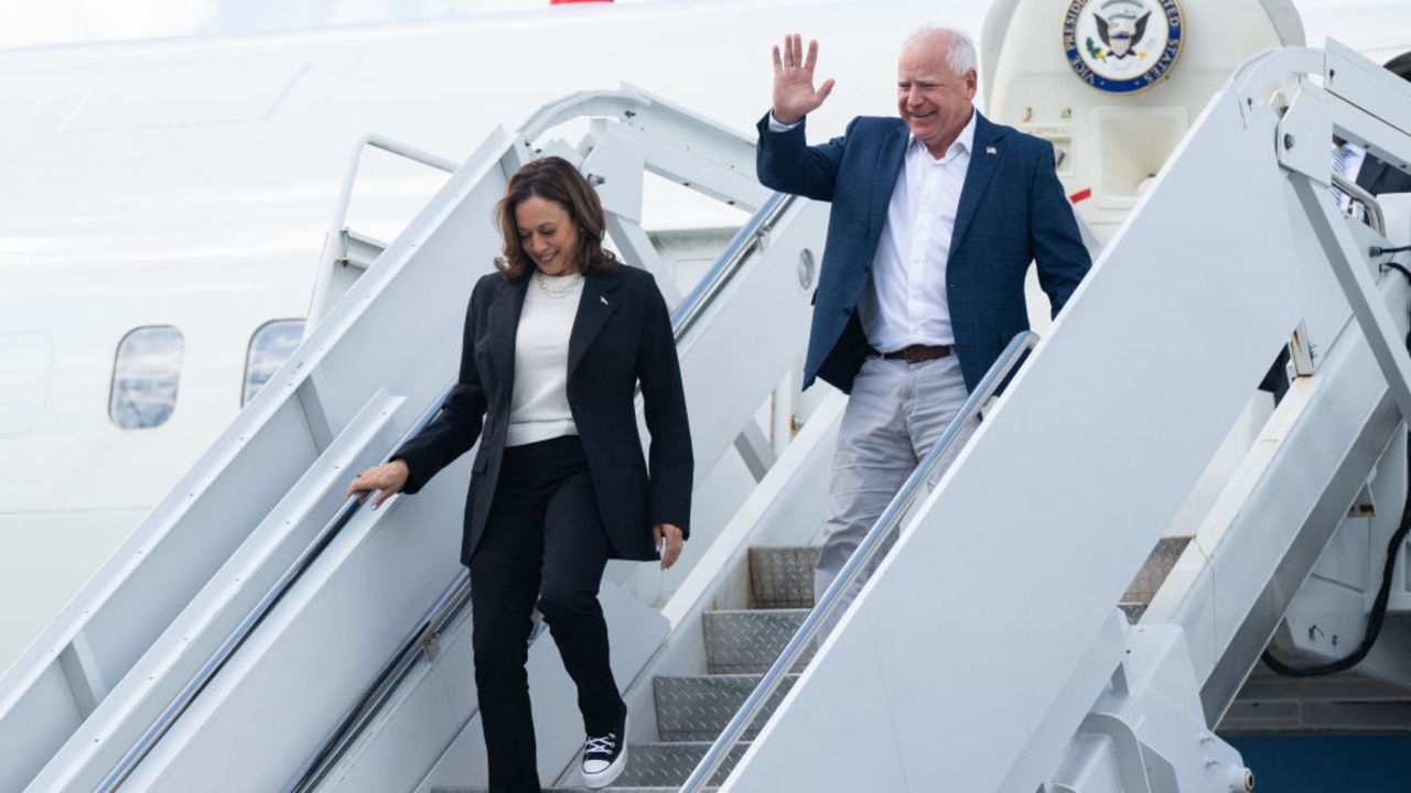 (L-R) US Vice President and Democratic presidential candidate Kamala Harris and her running mate Minnesota Governor Tim Walz step off Air Force Two upon arrival at Savannah/Hilton Head International Airport in Savannah, Georgia, August 28, 2024, as they travel for a 2-day campaign bus tour. (Photo by SAUL LOEB / AFP) (Photo by SAUL LOEB/AFP via Getty Images)