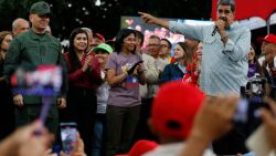 Venezuelan President Nicolas Maduro (R) gestures as he delivers a speech next to Venezuelan Defense Minister Gen. Vladimir Padrino (L) and the Vice President of Venezuela, Delcy Rodríguez (2nd-R), during a rally in Caracas on August 28, 2024. The Venezuelan ruling party called for a mobilization on August 28, to 'celebrate' Maduro's victory, which has been rejected by the United States, the European Union and several countries in the region. (Photo by Pedro Rances Mattey / AFP) (Photo by PEDRO RANCES MATTEY/AFP via Getty Images)