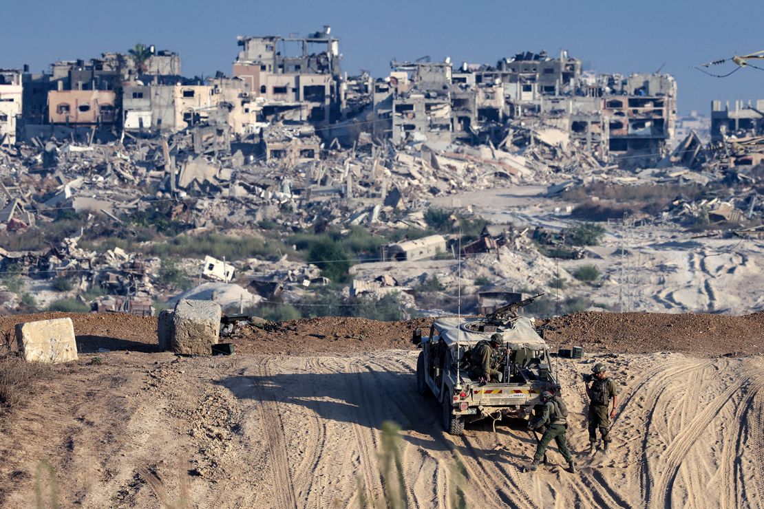 Israeli troops operate on their side of the fence separating Israel from the Gaza Strip on August 29, 2024, amid the ongoing conflict between Israel and the militant group Hamas.