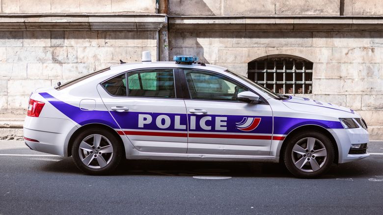 A police car says POLICE in the colors blue white red, in Lyon, France, August 25, 2024.