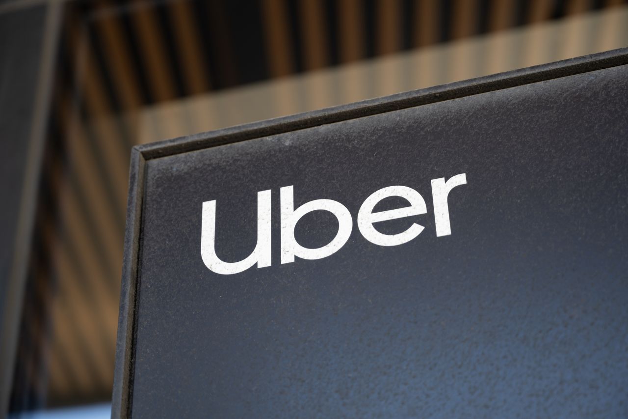 Close-up of Uber logo on a black sign at the company's headquarters in Mission Bay, San Francisco, California, August 20, 2024. (Photo by Smith Collection/Gado/Getty Images)