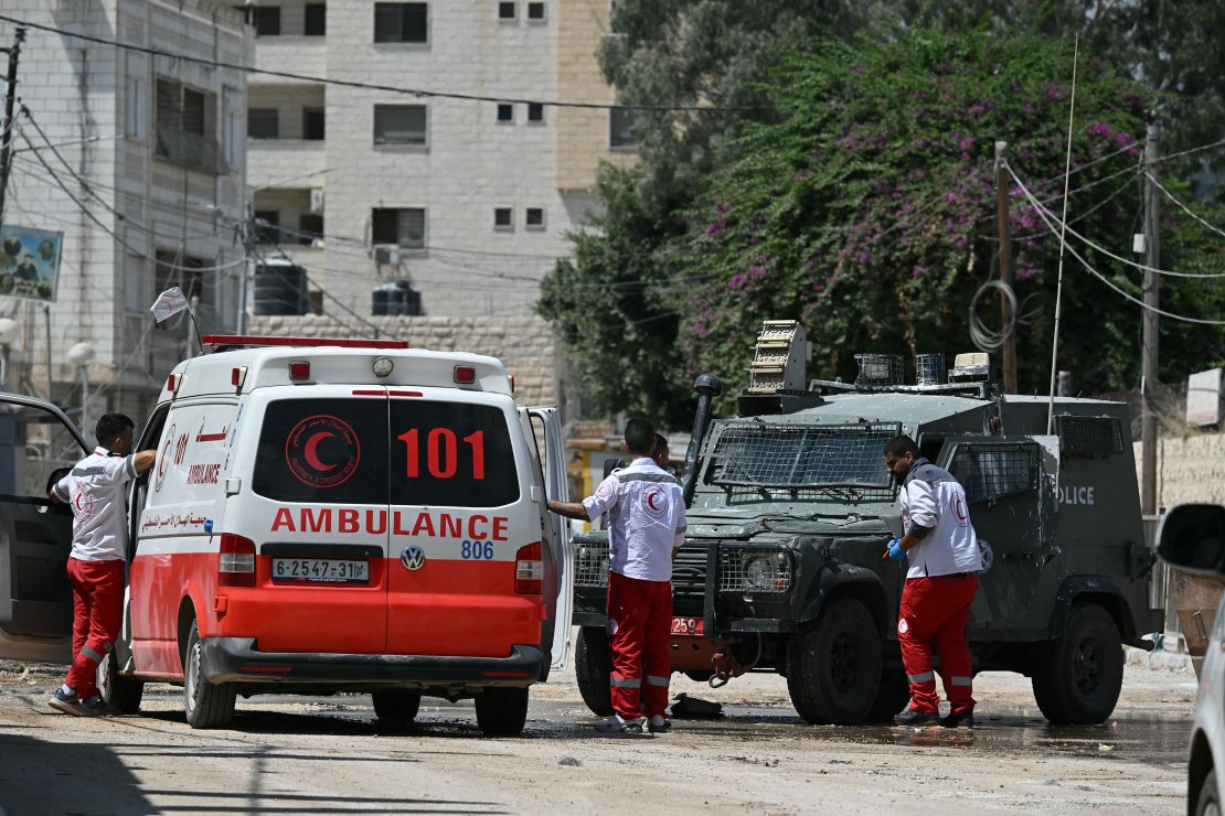 An Israeli army blocks a road leading to a hospital in Jenin in the occupied West Bank on August 30, 2024, where ambulances are checked before reaching the medical facility. The United Nations has warned the military operation which Israel launched in the West Bank early on August 28 is "fuelling an already explosive situation" in the territory and has pressed Israel to end it. (Photo by RONALDO SCHEMIDT / AFP) (Photo by RONALDO SCHEMIDT/AFP via Getty Images)