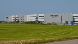 This photograph shows the logo of US multinational company Amazon displaying on the facade of the distribution centre in Augny, near Metz, eastern France, on August 29, 2024. The Augny site, equipped with cutting-edge technology which guarantees the safety and well-being of employees, covers 180,000 square metres and employs around 4,000 people. Amazon reintroduces consumer visits that had been interrupted during COVID19, to rehabilitate its image, damaged by criticism of working conditions in its warehouses. (Photo by Jean-Christophe VERHAEGEN / AFP) (Photo by JEAN-CHRISTOPHE VERHAEGEN/AFP via Getty Images)