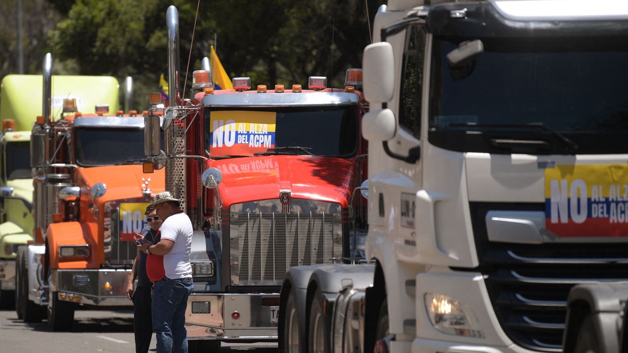 Cargo trucker drivers attend a protest against the increase in fuel prices in Bogota on August 30, 2024. Colombia's cargo trucker drivers protested on Friday with their vehicles in several cities in the country against the increase in diesel prices announced a week ago by the government. (Photo by Daniel MUNOZ / AFP) (Photo by DANIEL MUNOZ/AFP via Getty Images)