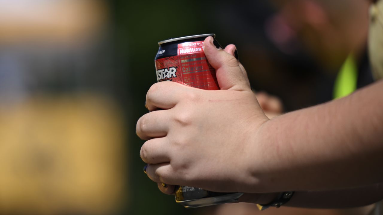 PORTLAND, OREGON - AUGUST 25: A fan holds a Rockstar Energy drink during the women’s street final during day three of the Rockstar Energy Open on August 25, 2024 in Portland, Oregon. (Photo by Eakin Howard/Getty Images for Rockstar Energy)