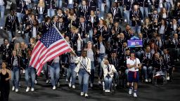 PARIS, FRANCE - AUGUST 28: Nicky Nieves and Steve Serio, Flag Bearers of Team United States, hold their national flag as they parade during the opening ceremony of the Paris 2024 Summer Paralympic Games at Place de la Concorde on August 28, 2024 in Paris, France. (Photo by Elsa/Getty Images)