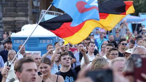 DRESDEN, GERMANY - AUGUST 29: Supporters of the far-right Alternative for Germany (AfD) political party gather with German flags at the final AfD Saxony election rally prior to state elections on August 29, 2024 in Dresden, Germany. The AfD is currently leading in polls in both Saxony and Thuringia ahead of state elections scheduled for Sunday in both states. (Photo by Sean Gallup/Getty Images)