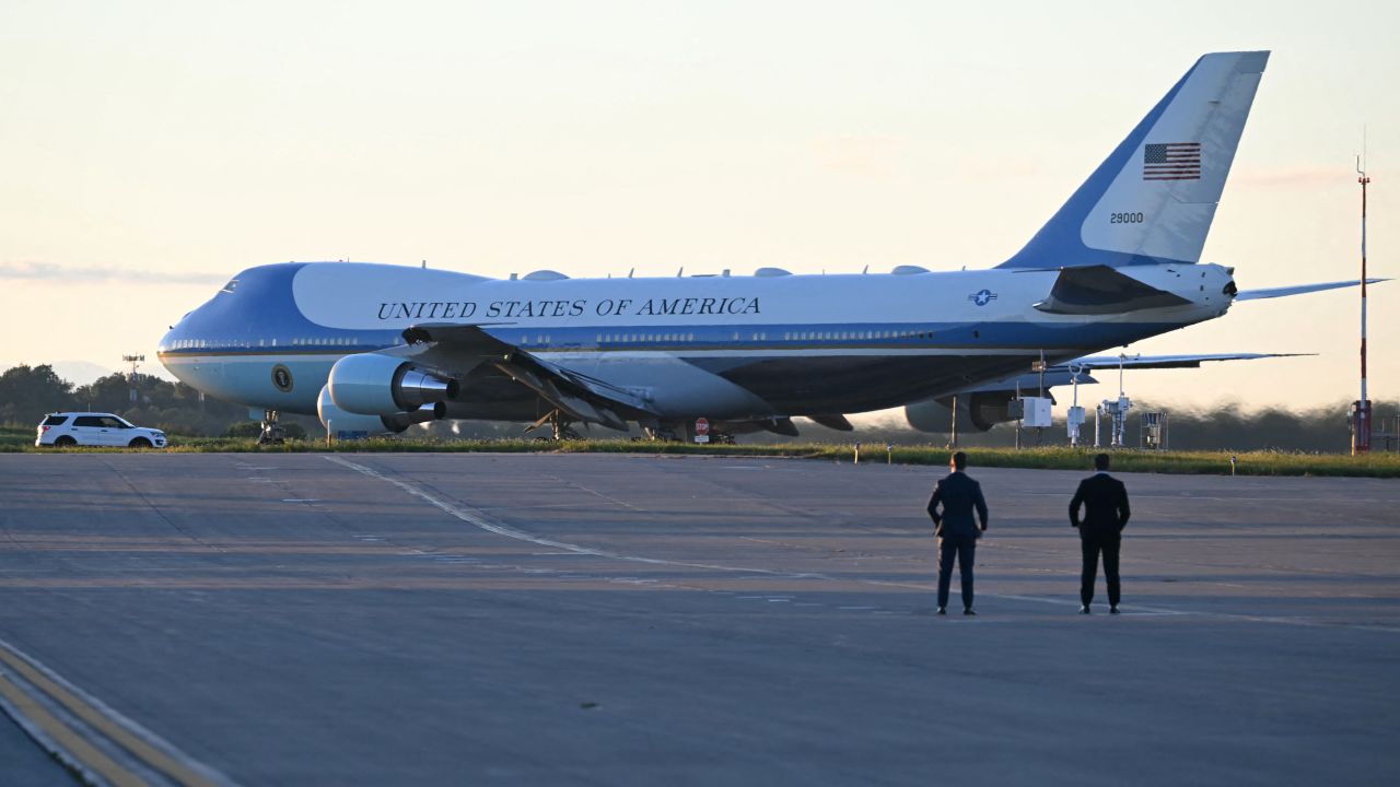 US Secret Service agents watch as Air Force One carrying US President Joe Biden prepares to take off from Pittsburgh International Airport in Pittsburgh, Pennsylvania, on September 2, 2024. Biden is returning to Washington, DC, after attending a campaign event. (Photo by ANDREW CABALLERO-REYNOLDS / AFP) (Photo by ANDREW CABALLERO-REYNOLDS/AFP via Getty Images)